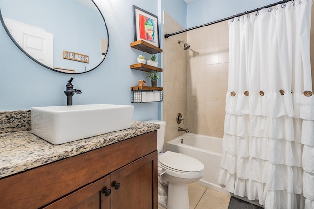 bathroom with toilet, vanity, shower / tub combo with curtain, and tile patterned floors