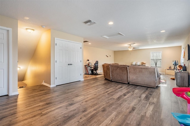 living area with attic access, wood finished floors, recessed lighting, and baseboards
