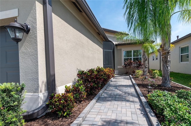 4888 Sevilla Shores Dr, Wimauma, FL 33598 - doorway to property with stucco siding