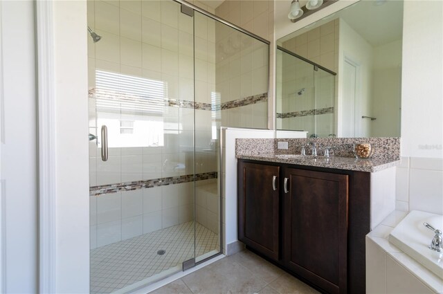 4888 Sevilla Shores Dr, Wimauma, FL 33598 - full bathroom with a stall shower, vanity, tile patterned floors, and a garden tub