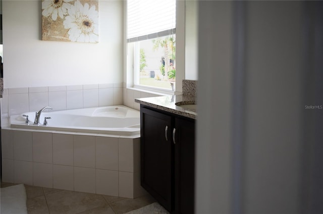4888 Sevilla Shores Dr, Wimauma, FL 33598 - full bath featuring a bath, tile patterned flooring, and vanity