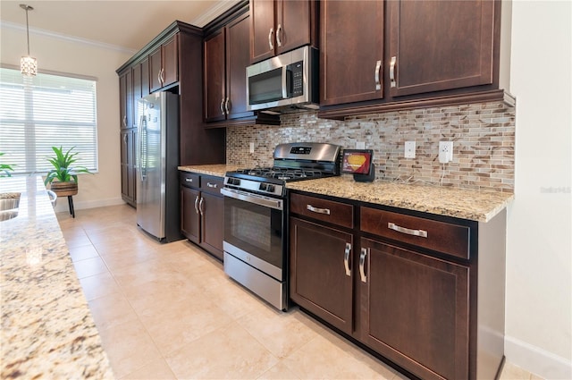 4888 Sevilla Shores Dr, Wimauma, FL 33598 - kitchen featuring stainless steel appliances, crown molding, decorative backsplash, baseboards, and dark brown cabinetry