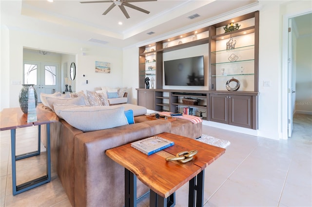 4888 Sevilla Shores Dr, Wimauma, FL 33598 - living area with a ceiling fan, ornamental molding, light tile patterned floors, a raised ceiling, and built in shelves
