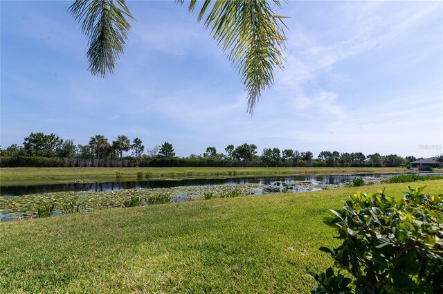 4888 Sevilla Shores Dr, Wimauma, FL 33598 - view of grassy yard featuring a water view