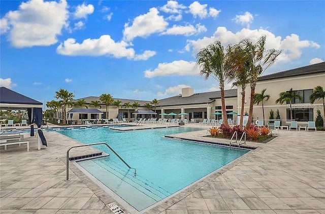 4888 Sevilla Shores Dr, Wimauma, FL 33598 - community pool featuring a gazebo and a patio area