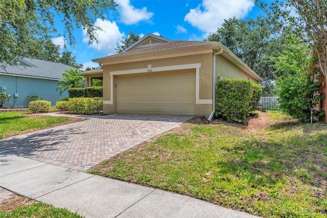 11808 Holly Crest Ln, Riverview, FL 33569 - view of front of property with decorative driveway, a garage, and stucco siding