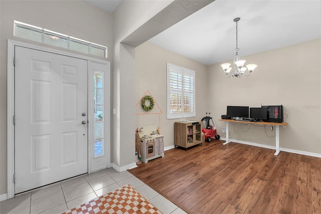 11808 Holly Crest Ln, Riverview, FL 33569 - foyer entrance featuring a chandelier, baseboards, and light tile patterned floors