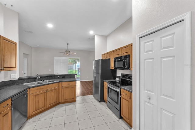 11808 Holly Crest Ln, Riverview, FL 33569 - kitchen with appliances with stainless steel finishes, a sink, dark countertops, light tile patterned flooring, and recessed lighting