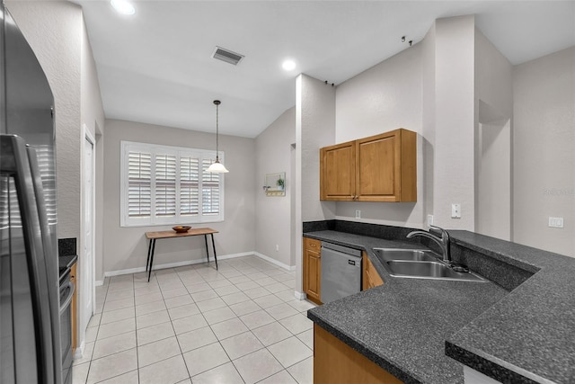 11808 Holly Crest Ln, Riverview, FL 33569 - kitchen featuring appliances with stainless steel finishes, a sink, dark countertops, light tile patterned floors, and vaulted ceiling