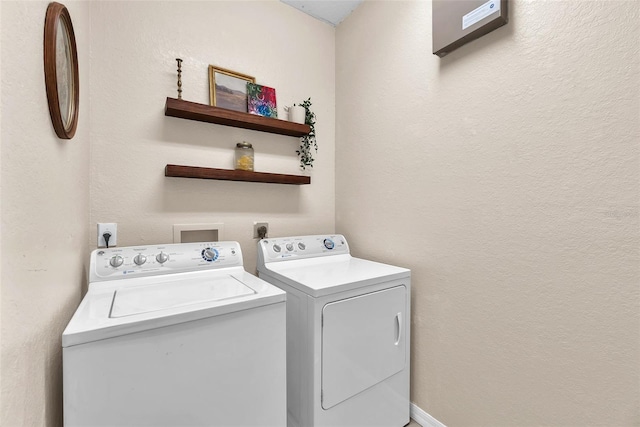 11808 Holly Crest Ln, Riverview, FL 33569 - washroom featuring independent washer and dryer and a textured wall