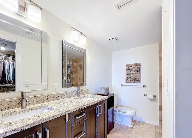 100 Pierce St Unit 910, Clearwater, FL 33756 - full bath with toilet, double vanity, a tile shower, and a walk in closet