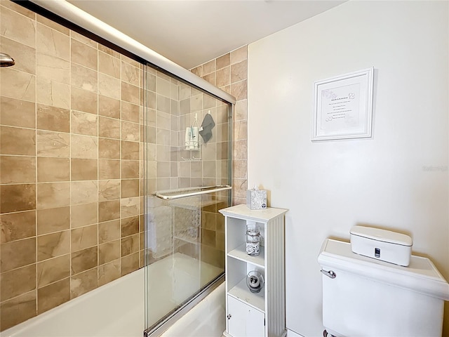 100 Pierce St Unit 910, Clearwater, FL 33756 - bathroom featuring shower / bath combination with glass door and toilet