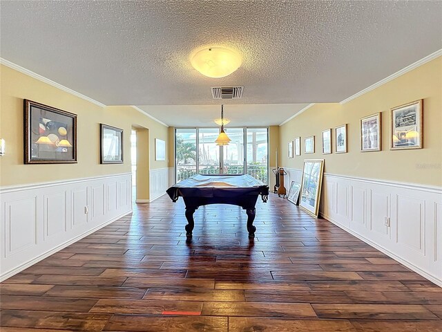 100 Pierce St Unit 910, Clearwater, FL 33756 - game room with crown molding, dark wood-style floors, a textured ceiling, pool table, and a wainscoted wall