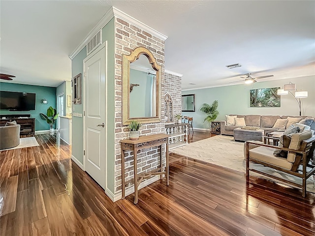 3093 Hillside Ln, Safety Harbor, FL 34695 - corridor with wood finished floors, crown molding, and baseboards