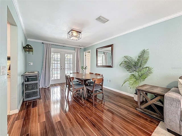 3093 Hillside Ln, Safety Harbor, FL 34695 - dining area featuring crown molding, french doors, wood finished floors, and baseboards