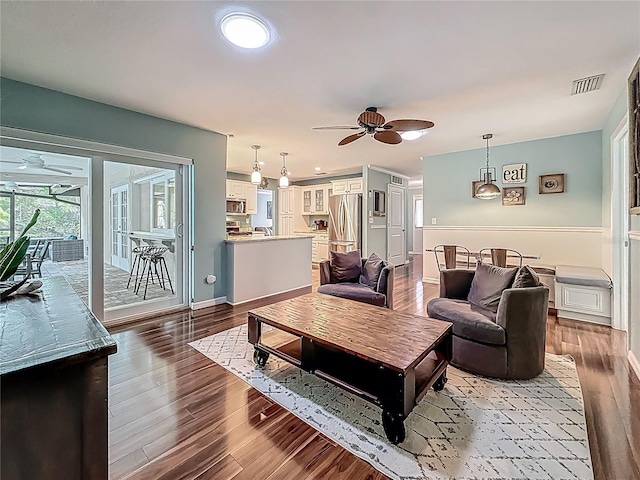 3093 Hillside Ln, Safety Harbor, FL 34695 - living room with a ceiling fan, wood finished floors, and baseboards