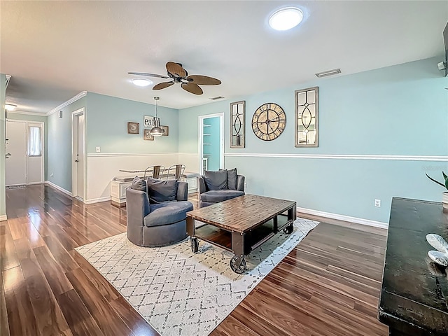 3093 Hillside Ln, Safety Harbor, FL 34695 - living room with a ceiling fan, dark wood-style floors, baseboards, and crown molding