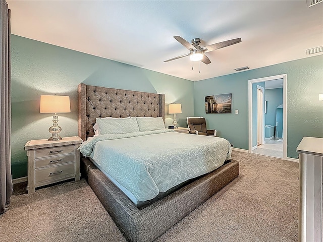 3093 Hillside Ln, Safety Harbor, FL 34695 - bedroom with carpet flooring, baseboards, a textured wall, a ceiling fan, and ensuite bathroom