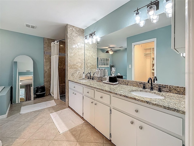 3093 Hillside Ln, Safety Harbor, FL 34695 - bathroom with tile patterned floors, double vanity, a ceiling fan, and curtained shower