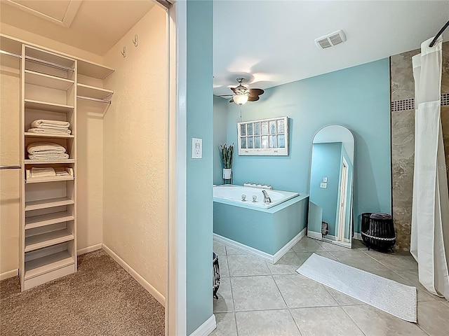 3093 Hillside Ln, Safety Harbor, FL 34695 - full bathroom with a garden tub, a ceiling fan, a spacious closet, and tile patterned flooring