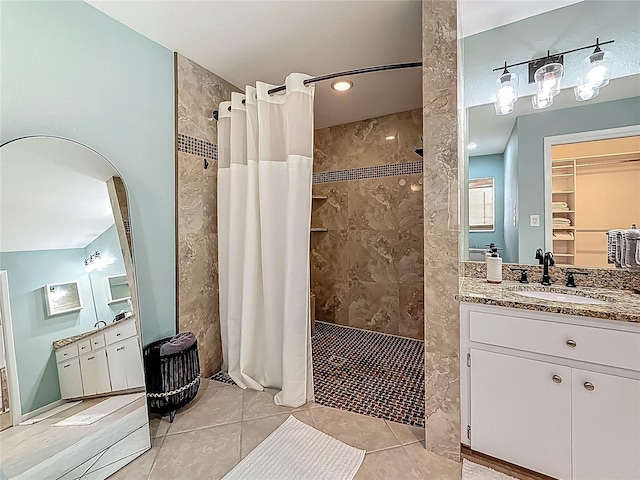 3093 Hillside Ln, Safety Harbor, FL 34695 - full bathroom featuring a tile shower, vanity, and tile patterned floors