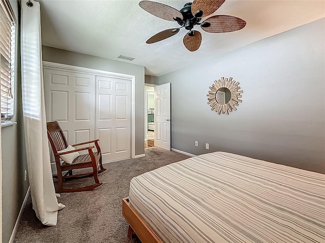 3093 Hillside Ln, Safety Harbor, FL 34695 - bedroom featuring dark carpet, baseboards, a closet, ceiling fan, and a textured ceiling