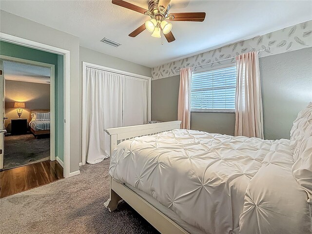 3093 Hillside Ln, Safety Harbor, FL 34695 - bedroom with dark carpet and ceiling fan
