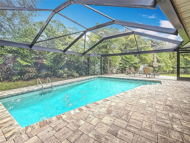 3093 Hillside Ln, Safety Harbor, FL 34695 - outdoor pool with a patio area and glass enclosure