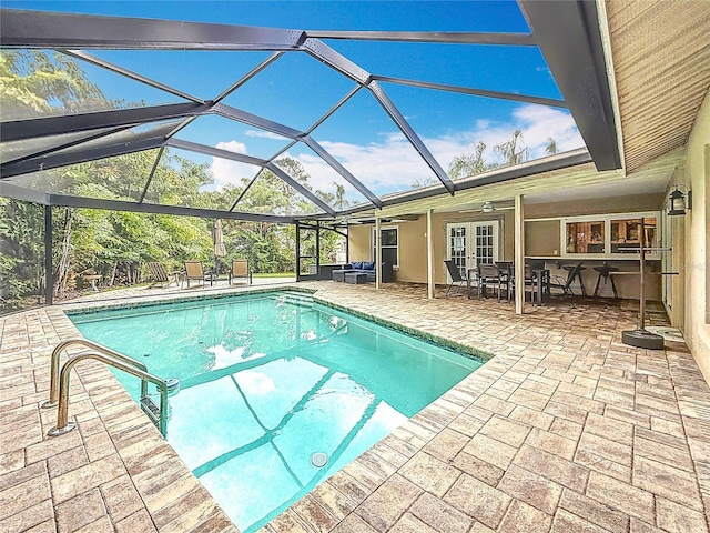 3093 Hillside Ln, Safety Harbor, FL 34695 - outdoor pool featuring french doors, a patio area, ceiling fan, and glass enclosure