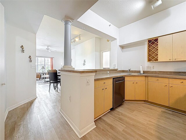 200 4th Ave S Unit 229, Saint Petersburg, FL 33701 - kitchen featuring stainless steel dishwasher, decorative columns, a peninsula, and light wood-style flooring