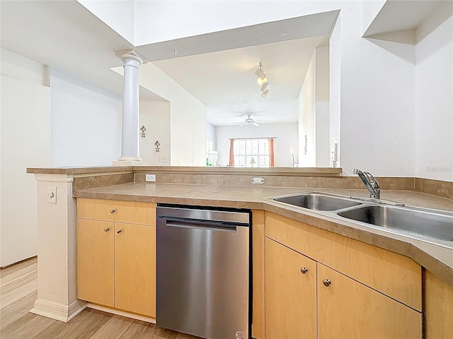 200 4th Ave S Unit 229, Saint Petersburg, FL 33701 - kitchen with stainless steel dishwasher, light brown cabinets, decorative columns, light wood finished floors, and ceiling fan
