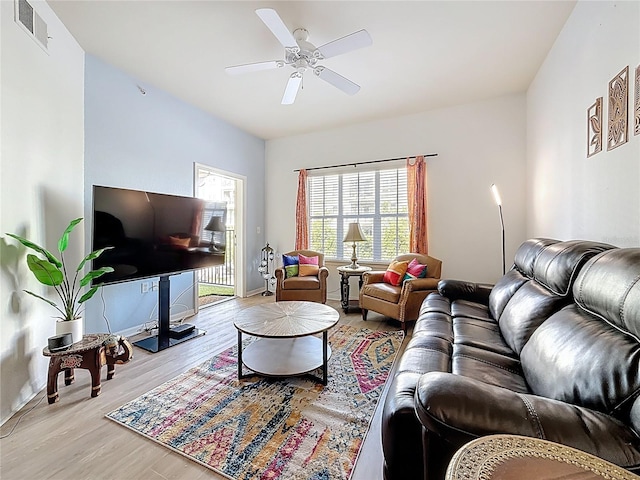 200 4th Ave S Unit 229, Saint Petersburg, FL 33701 - living room with wood finished floors, a ceiling fan, and baseboards