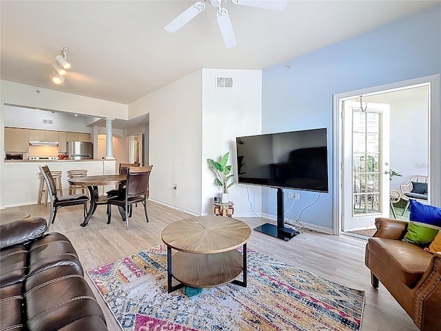 200 4th Ave S Unit 229, Saint Petersburg, FL 33701 - living room featuring decorative columns, light wood-type flooring, a ceiling fan, and baseboards