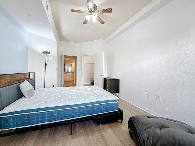 200 4th Ave S Unit 229, Saint Petersburg, FL 33701 - bedroom with wood finished floors, baseboards, ceiling fan, a spacious closet, and a closet