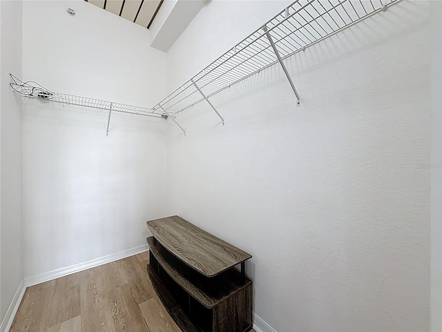 200 4th Ave S Unit 229, Saint Petersburg, FL 33701 - spacious closet featuring wood finished floors and lofted ceiling