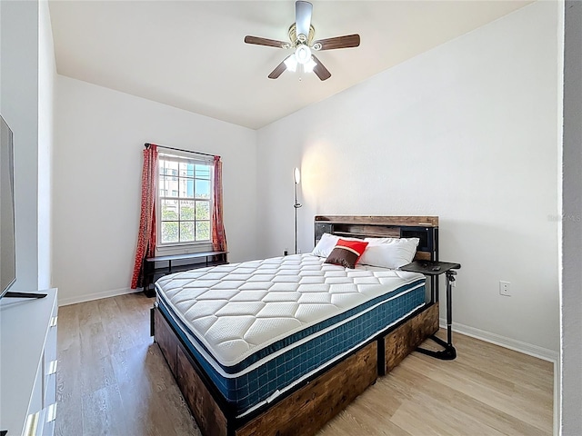 200 4th Ave S Unit 229, Saint Petersburg, FL 33701 - bedroom with wood finished floors, baseboards, and ceiling fan