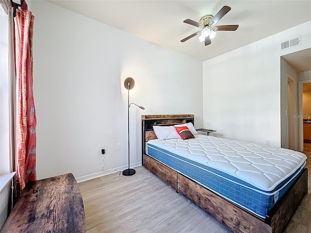200 4th Ave S Unit 229, Saint Petersburg, FL 33701 - bedroom featuring wood finished floors, baseboards, and ceiling fan