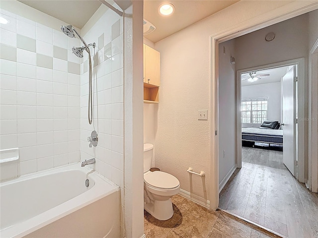 200 4th Ave S Unit 229, Saint Petersburg, FL 33701 - bathroom with toilet, baseboards, a ceiling fan, and shower / tub combination