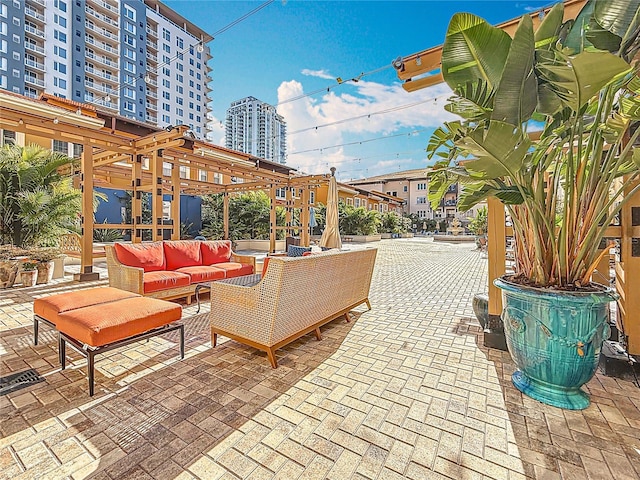 200 4th Ave S Unit 229, Saint Petersburg, FL 33701 - view of patio / terrace featuring a pergola and an outdoor hangout area