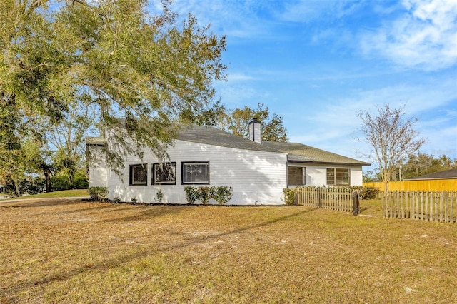 back of property featuring a chimney