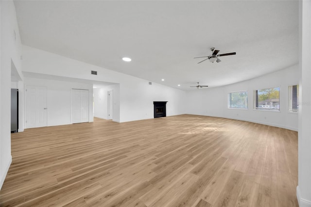 unfurnished living room featuring light wood-type flooring, a fireplace, ceiling fan, recessed lighting, and baseboards