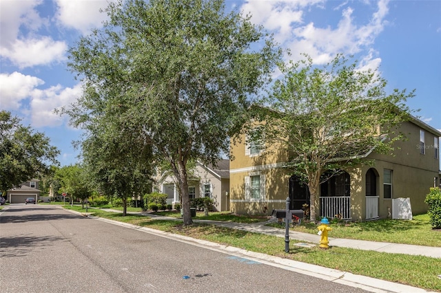 13421 Lake Monroe Pl, Riverview, FL 33579 - view of property hidden behind natural elements with stucco siding