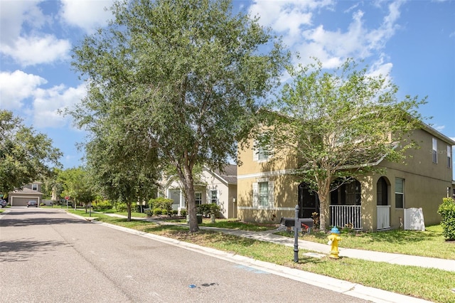 13421 Lake Monroe Pl, Riverview, FL 33579 - view of property hidden behind natural elements featuring stucco siding