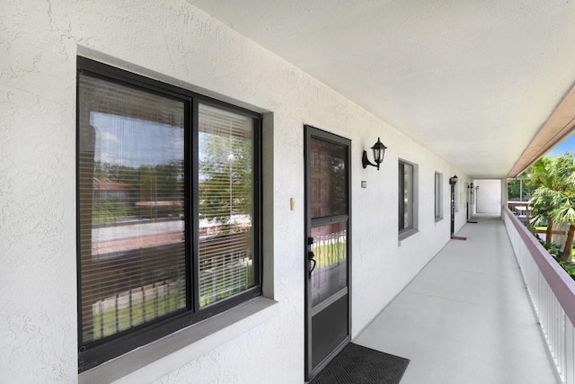 172 Lakeview Way Unit 172, Oldsmar, FL 34677 - entrance to property with stucco siding and a balcony