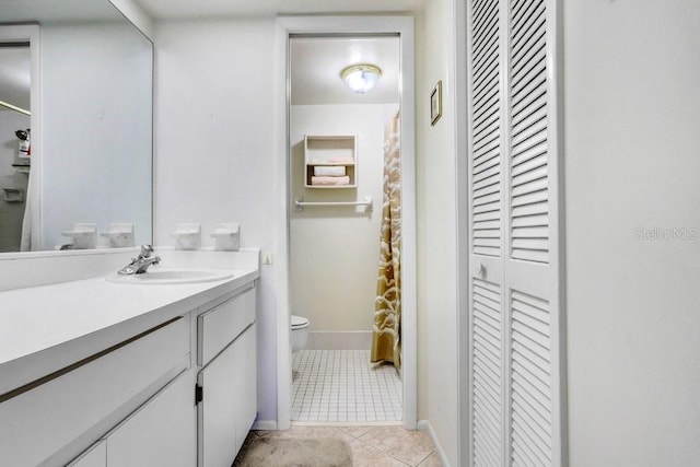 172 Lakeview Way Unit 172, Oldsmar, FL 34677 - bathroom featuring a closet, toilet, tile patterned floors, vanity, and baseboards