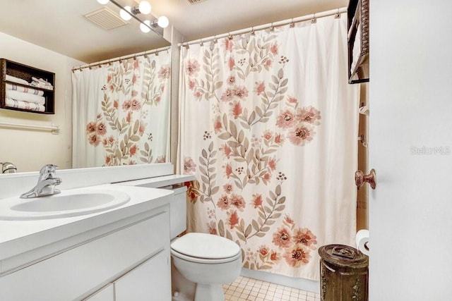 172 Lakeview Way Unit 172, Oldsmar, FL 34677 - bathroom with vanity, toilet, tile patterned flooring, and a shower with curtain