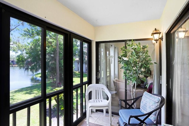 172 Lakeview Way Unit 172, Oldsmar, FL 34677 - sunroom with a water view and tile patterned floors