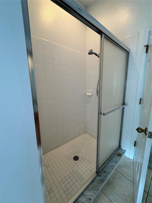 bathroom featuring a shower stall