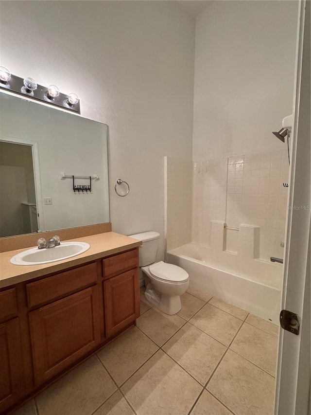 bathroom featuring tile patterned flooring, vanity, toilet, and tub / shower combination