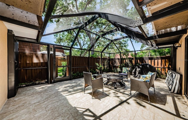 2706 11th Ct, Palm Harbor, FL 34684 - fenced backyard featuring a fire pit, a patio area, and a lanai